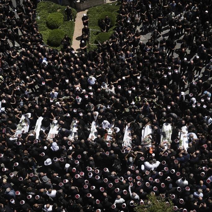 Israel weighs response to Hezbollah after a rocket from Lebanon kills 12 youths on a soccer field